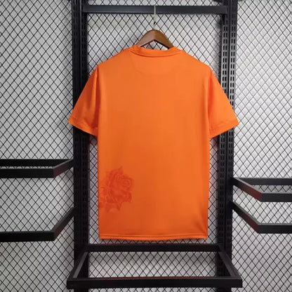 Camisola Real Madrid Away Laranja 24/25 - Versão Adepto