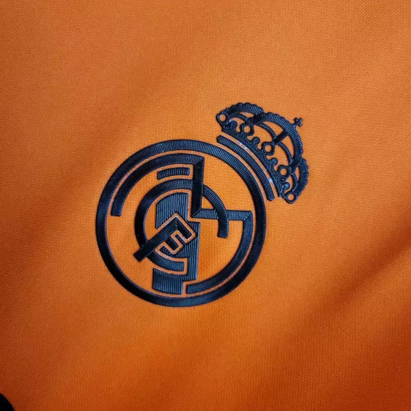 Camisola Real Madrid Away Laranja 24/25 - Versão Adepto